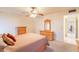 Well lit bedroom with carpet, a ceiling fan, and matching wooden furniture at 10726 W Pineaire Dr, Sun City, AZ 85351
