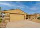 Charming single-story home featuring a two-car garage, desert landscaping, and a welcoming facade at 10726 W Pineaire Dr, Sun City, AZ 85351