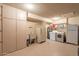 Spacious laundry room with tile flooring, ample storage, and modern appliances at 10726 W Pineaire Dr, Sun City, AZ 85351