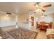 Open-concept space combining living room and kitchen, perfect for gatherings and entertaining at 10726 W Pineaire Dr, Sun City, AZ 85351