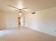 Spacious living room with tile flooring and easy access to other areas of the house at 10726 W Pineaire Dr, Sun City, AZ 85351