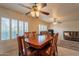 Living Room with ample natural light from the large windows and ceiling fans at 10726 W Pineaire Dr, Sun City, AZ 85351