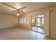 Bright living room featuring a sliding glass door to the outdoors at 10726 W Pineaire Dr, Sun City, AZ 85351