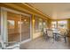 Comfortable outdoor patio with ample seating, tiled floors, and a covered roof at 10726 W Pineaire Dr, Sun City, AZ 85351