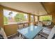 Cozy outdoor patio with seating area offering views of a private backyard at 10726 W Pineaire Dr, Sun City, AZ 85351