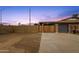 Property featuring privacy wall, front gate and garage at 1210 E Harmony Cir, Mesa, AZ 85204