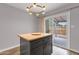 Eat-in kitchen island with granite countertop and stylish light fixture at 1210 E Harmony Cir, Mesa, AZ 85204