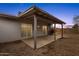 Spacious covered patio, a blank slate perfect for creating your dream backyard oasis at 1210 E Harmony Cir, Mesa, AZ 85204