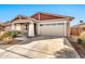 Inviting one-story home with a well-manicured yard and attached two-car garage at 1243 E Glass Ln, Phoenix, AZ 85042