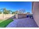 Well-maintained backyard with charming landscaping and practical storage solutions, blending beauty and functionality at 13214 S 39Th St, Phoenix, AZ 85044