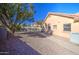 Spacious backyard featuring a landscaped area and the home's exterior, perfect for outdoor activities and relaxation at 13214 S 39Th St, Phoenix, AZ 85044