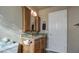 Bathroom featuring granite countertops and wooden cabinets at 13214 S 39Th St, Phoenix, AZ 85044