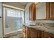 Bathroom with a glass block shower and granite countertop vanity at 13214 S 39Th St, Phoenix, AZ 85044