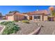 Inviting single-story home featuring desert landscaping, a two-car garage, and beautiful curb appeal at 13214 S 39Th St, Phoenix, AZ 85044