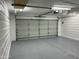 Spacious garage features epoxy flooring and ample room for parking at 13214 S 39Th St, Phoenix, AZ 85044