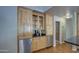 Kitchen area features wood cabinets, granite counters, and stainless steel appliances at 13214 S 39Th St, Phoenix, AZ 85044