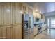Spacious eat-in kitchen with stainless appliances, maple cabinets, and granite countertops at 13214 S 39Th St, Phoenix, AZ 85044