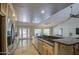 Spacious eat-in kitchen with stainless appliances, maple cabinets, and granite countertops at 13214 S 39Th St, Phoenix, AZ 85044