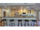The spacious eat-in kitchen has stainless appliances and seating at the granite countertop at 13214 S 39Th St, Phoenix, AZ 85044