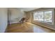 Bright living room features gleaming hardwood floors, neutral tones, and a large window with views at 13214 S 39Th St, Phoenix, AZ 85044
