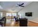 Spacious open-concept living room with vaulted ceilings, hardwood floors, and modern ceiling fan at 13214 S 39Th St, Phoenix, AZ 85044