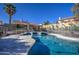 Sparkling pool with patio seating and a secure fence, perfect for summer relaxation and entertainment at 13214 S 39Th St, Phoenix, AZ 85044