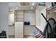 Organized walk-in closet with custom shelving and drawers for optimal storage and organization in the home at 13214 S 39Th St, Phoenix, AZ 85044