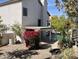 Charming covered patio, complete with a lush bougainvillea, offers a delightful view of the refreshing pool at 13517 N 102Nd Pl, Scottsdale, AZ 85260