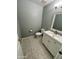 Updated powder room with neutral paint, tiled flooring, a modern vanity, and a toilet at 13517 N 102Nd Pl, Scottsdale, AZ 85260