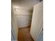 Walk-in closet featuring shelving, carpeted floor, and lighting at 13517 N 102Nd Pl, Scottsdale, AZ 85260