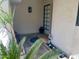 Inviting entrance featuring desert plants in beds and offering a glimpse of the tranquil indoor space at 13517 N 102Nd Pl, Scottsdale, AZ 85260