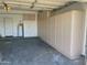 Spacious garage with a water heater and built-in storage cabinets at 13517 N 102Nd Pl, Scottsdale, AZ 85260