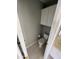 A cozy powder room features a toilet, cabinet, and light neutral walls, perfect for guests at 13517 N 102Nd Pl, Scottsdale, AZ 85260