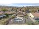 Home featuring a freeform swimming pool and covered patio surrounded by mature landscaping and a fence at 15039 S 28Th St, Phoenix, AZ 85048
