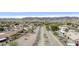 Aerial view of homes in a desert community with native vegetation, mountains, and rock-lined wash at 15039 S 28Th St, Phoenix, AZ 85048