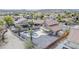 Aerial view of a fenced property showcasing an extended covered patio and freeform pool at 15039 S 28Th St, Phoenix, AZ 85048