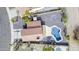 An aerial view of a home highlighting the distinct tile roof and freeform swimming pool at 15039 S 28Th St, Phoenix, AZ 85048