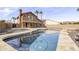 Gorgeous backyard featuring custom pool area, palm trees, and nice desert landscaping at 15039 S 28Th St, Phoenix, AZ 85048