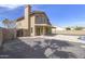 Exterior shot of the backyard showing the covered patio and pristine pool at 15039 S 28Th St, Phoenix, AZ 85048