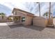 Exterior of home with covered patio, storage shed, and desert landscaping at 15039 S 28Th St, Phoenix, AZ 85048