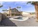 Exterior: Beautiful backyard view showcasing pool area, palms, and desert landscaping at 15039 S 28Th St, Phoenix, AZ 85048