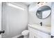 Neat bathroom with a white vanity, new toilet, bright mirror, walk-in shower and bronze fixtures at 15039 S 28Th St, Phoenix, AZ 85048
