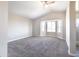Spacious bedroom with vaulted ceilings and large window letting in natural light, plus neutral carpet and paint at 15039 S 28Th St, Phoenix, AZ 85048