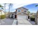 Charming two-story home with a two-car garage, landscaped yard, and steps leading up to a red front door at 15039 S 28Th St, Phoenix, AZ 85048