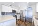 Well-equipped kitchen showcasing stainless steel appliances, white cabinetry, and stone countertops at 15039 S 28Th St, Phoenix, AZ 85048