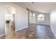 Spacious open floor plan featuring vaulted ceiling, large windows, and access to the kitchen at 15039 S 28Th St, Phoenix, AZ 85048