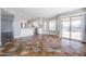 Open-concept living room with access to kitchen, pool view, and sliding glass doors for outdoor access at 15039 S 28Th St, Phoenix, AZ 85048