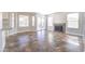 Sunlit living room with sliding glass doors, stone fireplace, and tile flooring throughout at 15039 S 28Th St, Phoenix, AZ 85048