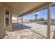 Covered patio with patterned tile floors overlooks the backyard pool area at 15039 S 28Th St, Phoenix, AZ 85048