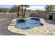 Custom backyard pool and patio area with nice tiling and desert landscaping at 15039 S 28Th St, Phoenix, AZ 85048
